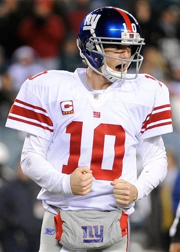 
 New York Giants quarterback Eli Manning celebrates his touchdown pass to wide receiver Derek Hagan during the second half of an NFL football game against the Philadelphia Eagles in Philadelphia, Sunday, Nov. 21, 2010. (AP Photo/Miles Kennedy)
 