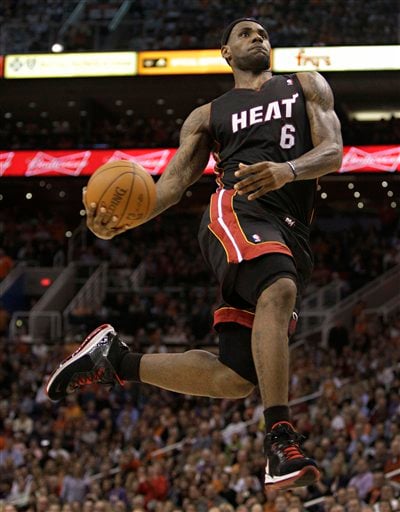 lebron james heat dunking. Miami Heat forward LeBron