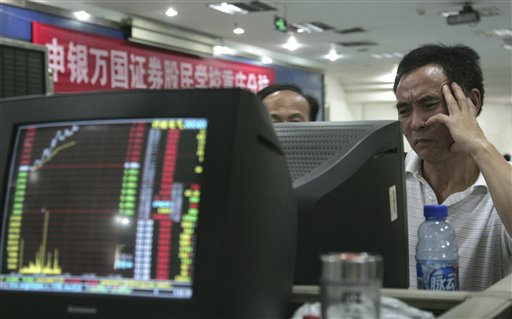 
 Investors look at a stock price monitor at a private securities company Tuesday, Aug. 31, 2010 in Chongqing, China. China's stock benchmark retreated as Asian markets sank Tuesday as a strong yen pummeled Japanese shares and pessimism about the U.S. economy intensified. (AP Photo)
 