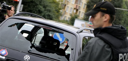 
 Windows of the nearby car have been shattered by bullets at the scene of fatal shooting in Bratislava, Slovakia, Monday, Aug 30, 2010. A gunman went on a rampage in Slovakia's capital on Monday, killing seven people and wounding 15, then committed suicide, officials said. (AP Photo/TASR, Martin Baumann) ** SLOVAKIA OUT **
 