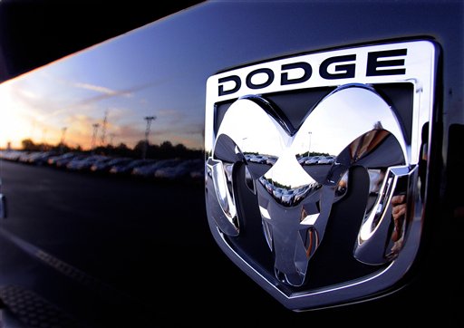 
 In this Aug. 15, 2010 photograph, the Dodge logo is seen on a new Dodge RAM 3500 Heavy Duty pickup trucks at sunset at a dealership in Springfield, Ill. Chrysler Group LLC said Wednesday, Sept. 1, 2010, its August sales rose 7 percent over July as many of its models saw gains. (AP Photo/Seth Perlman)
 