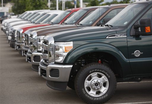 
 FILE - In this file photograph taken June 27, 2010, unsold 2011 Ford F-350 pickup trucks sit at a dealership in the west Denver suburb of Lakewood, Colo. Ford Motor Co. said Wenesday, Sept. 1, 2010, its U.S. auto sales dipped 5 percent in August compared with July as consumers continued to hold off on big purchases. (AP Photo/David Zalubowski, file)
 