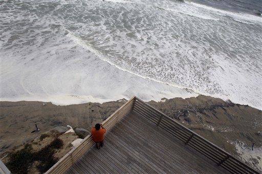 
 High tide moves close to a hotel deck as Nags Head, N.C., Thursday, Sept. 2, 2010 as Hurricane Earl moves closer to North Carolina's Outer Banks. (AP Photo/Gerry Broome)
 