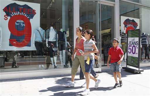 
 In this July 30, 2010 photo, Rajni Gupta and her children Anooshka, 10, and Kiril, 7, leave Aeropostale after shopping for back-to-school clothes, in New York. The U.S. service sector, the nation's predominant job generator, expanded for the eighth straight month in August although the pace of growth slowed, according to a trade group survey. (AP Photo/Mark Lennihan)
 