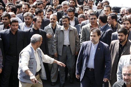 
 Escorted by his bodyguards, Iranian President Mahmoud Ahmadinejad, center, attends the annual state-sponsored rally known as Quds Day, or Jerusalem Day, in Tehran, Iran, Friday, Sept. 3, 2010. (AP Photo/Vahid Salemi)
 