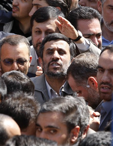 
 Escorted by his bodyguards, Iranian President Mahmoud Ahmadinejad, center, gestures, as he attends the annual state-sponsored rally known as Quds Day, or Jerusalem Day, in Tehran, Iran, Friday, Sept. 3, 2010. (AP Photo/Vahid Salemi)
 