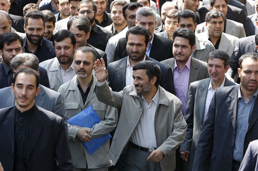 
 Escorted by his bodyguards, Iranian President Mahmoud Ahmadinejad, center, waves to his well wishers, as he attends the annual state-sponsored rally known as Quds Day, or Jerusalem Day, in Tehran, Iran, Friday, Sept. 3, 2010. (AP Photo/Vahid Salemi)
 