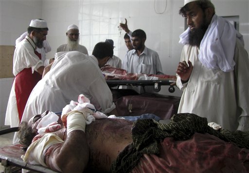 
 Injured victims of a suicide bombing are treated at a local hospital in Bannu, Pakistan on Monday, Sept. 6, 2010. A suicide bomber detonated a car in an alley behind a police station in a strategically vital town in northwest Pakistan, killing scores of police and civilians in an explosion that shattered the station and neighboring homes, police said. (AP Photo/Ijaz Mohammad)
 