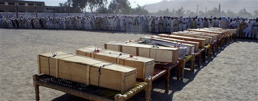 Pakistani tribesmen offering funeral prayer of the victims of NATO oil ...