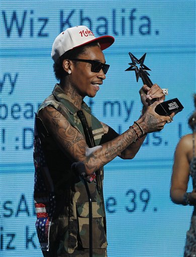 Wiz Khalifa accepts the award for best new artist at the BET Awards on 