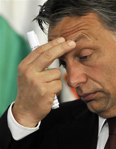 
 FILE - In this Oct. 12, 2010 file photo, Hungarian Prime Minister Viktor Orban gestures during a press conference with President of the European Commission Jose Manuel Barroso, not seen, in Pecs, Hungary. Hungary's democratic credentials are under scrutiny as it prepares to assume the EU presidency Saturday, with some critics accusing its leadership of creeping authoritarianism more suited to Belarus than Budapest. (AP Photo/Bela Szandelszky, File)
 