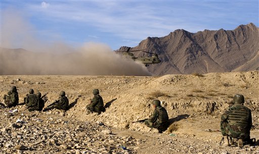 
 In this image provided by NATO Training Mission-Afghanistan, Afghan National Army soldiers rest before departing on patrol at the Kabul Military Training Center, Wednesday, Jan. 19, 2011, in Kabul, Afghanistan. NTMA advisers provide guidance to Afghan National Army instructors who are charged with conducting the bulk of training for ANA recruits. (AP Photo/ U.S. Navy Petty Officer 2nd Class Ernesto Hernandez Fonte)
 