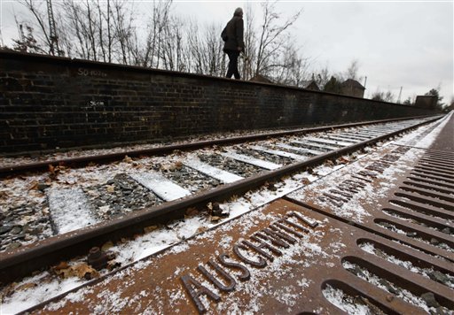 
 A man walks along the Gleis 17 (Track 17) memorial with the name of the Nazi death camp Auschwitz at the train station Grunewald on the international Holocaust remembrance day in Berlin, Germany, on Thursday, Jan. 27, 2011. From Oct. 1941 until Feb. 1945 the train station was one of the major sites of deportations of Berlin's Jewish community. (AP Photo/Markus Schreiber)
 