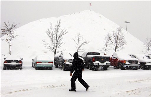 
 A mountain of snow towers over the back parking lot at The Loop shopping center in Methuen, Mass., Tuesday, Feb. 1, 2011. Layers of dangerous ice and blowing snow closed roads and airports from Texas to Rhode Island on Tuesday as a monster storm began bearing down on the nation. (AP Photo/Cheryl Senter)
 