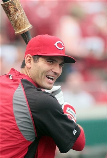
 Cincinnati Reds' Joey Votto smiles during batting practice before an exhibition baseball against the Reds Futures minor league team, Tuesday, April. 3, 2012 in Cincinnati. (AP Photo/Tony Tribble)
 