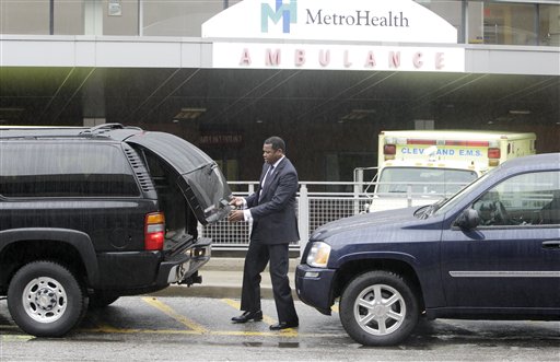 
 A Secret Service agent opens a hatch on a vehicle outside MetroHealth Hospital, Tuesday, Sept. 28, 2010, in Cleveland. Former President Jimmy Carter, on a trip promoting his new book, developed an upset stomach on a flight to Cleveland and was taken to the hospital for observation, officials said. (AP Photo/Tony Dejak)
 