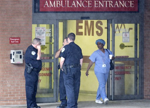 
 Police stand at an entrance to MetroHealth Hospital, Tuesday, Sept. 28, 2010, in Cleveland. Former President Jimmy Carter, on a trip promoting his new book, developed an upset stomach on a flight to Cleveland and was taken to the hospital for observation, officials said. (AP Photo/Tony Dejak)
 