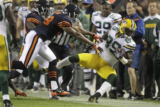 
 Chicago Bears wide receiver Devin Hester (23) races toward the end zone on a 62-yard punt return for touchdown against the Green Bay Packers during the second half of an NFL football game Monday, Sept. 27, 2010, in Chicago. (AP Photo/Kiichiro Sato)
 