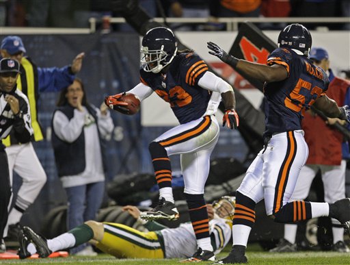 
 Chicago Bears wide receiver Devin Hester (23) celebrates with fans after returning a punt 62 yards for a touchdown against the Green Bay Packers during the second half of an NFL football game Monday, Sept. 27, 2010, in Chicago. (AP Photo/Charles Rex Arbogast)
 