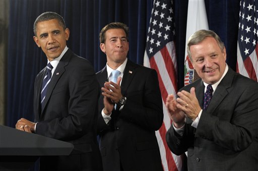 
 President Barack Obama, U.S. senatorial candidate Alexi Giannoulias, center, and Sen. Dick Durbin, D-Ill., look at people in the crowd during a fundraiser for Giannoulias at the Drake Hotel in Chicago, Thursday, Oct. 7, 2010. (AP Photo/Susan Walsh)
 