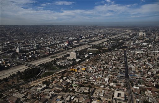 
 In this Sept. 29, 2010 photo is seen an aerial view of Tijuana, Mexico. A two-week $5 million festival called Innovative Tijuana starts Thursday Oct. 7, 2010 in the border city across from San Diego and aims to showcase the city's economic prowess and cultural riches in an effort to demonstrate the city is no longer in the grip of warring drug traffickers. (AP Photo/Guillermo Arias)
 