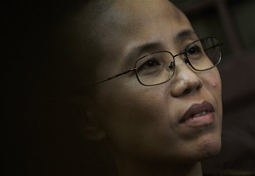 
 In this Sept. 28, 2010 file photo, Liu Xia, wife of Chinese dissident Liu Xiaobo, speaks about a December night nearly two years ago when her husband was taken away by the police from their apartment during an interview with The Associated Press in Beijing, China. Imprisoned Chinese dissident Liu Xiaobo won the 2010 Nobel Peace Prize on Friday, Oct. 8, 2010, for using non-violence to demand fundamental human rights in his homeland. (AP Photo/Andy Wong, File)
 