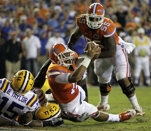 
 Florida tight end Jordan Reed, with ball, scores a touchdown on a 1-yard run past LSU safety Brandon Taylor (15) and linebacker Kelvin Sheppard during the first half of an NCAA college football game in Gainesville, Fla., Saturday, Oct. 9, 2010.(AP Photo/John Raoux)
 