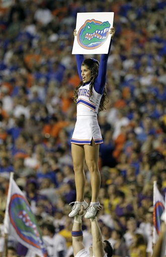 
 A Florida cheerleader rally's fans prior to kickoff against LSU during an NCAA college football game in Gainesville, Fla., Saturday, Oct. 9, 2010.(AP Photo/John Raoux)
 