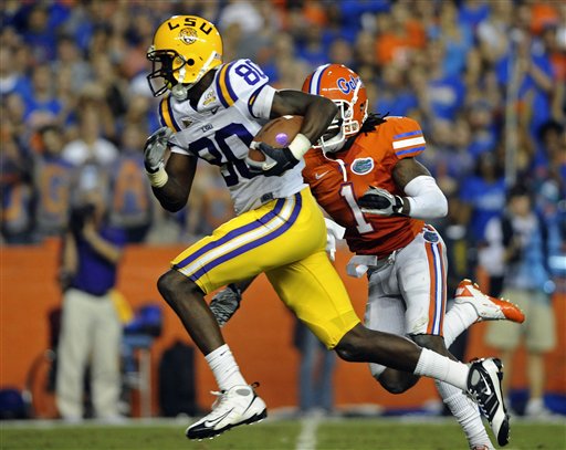 
 LSU wide receiver Terrence Toliver (80) runs past Florida cornerback Janoris Jenkins (1) for a 38-yard touchdown pass play during the first half of an NCAA college football game in Gainesville, Fla., Saturday, Oct. 9, 2010.(AP Photo/Phil Sandlin)
 