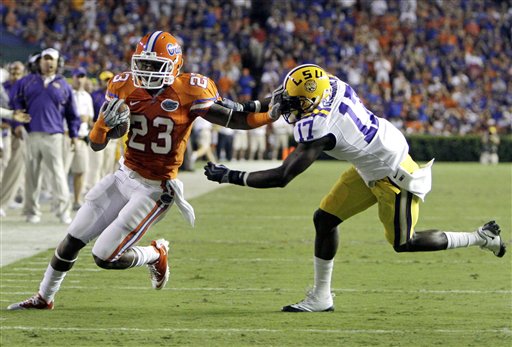 
 Florida's Mike Gillislee (23) runs around LSU cornerback Morris Claiborne (17) on a 13-yard pass play during the first half of an NCAA college football game in Gainesville, Fla., Saturday, Oct. 9, 2010.(AP Photo/John Raoux)
 