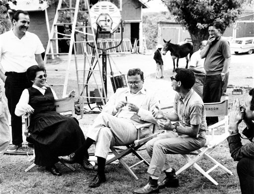 
 FILE - In this July 28, 1961 file photo, actress Anne Bancroft, left, producer Fred Coe and director Arthur Penn, right, discuss a scene during a break in filming of 'The Miracle Worker' on location in Middletown, N.J. (AP Photo/File)
 