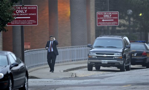 
 A secret service agent walks outside MetroHealth Hospital Wednesday, Sept. 29, 2010, in Cleveland. Former President Jimmy Carter, who spent the night at MetroHealth, is canceling scheduled book signing events in Washington as doctors continue their observations following Carter's overnight stay in Ohio for an upset stomach. (AP Photo/David Richard)
 