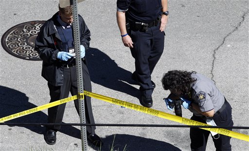 
 Police investigate a scene on the University of Texas campus near the site a gunman opened fire then killed himself inside a library, Tuesday, Sept. 28, 2010 in Austin. (AP Photo/Eric Gay)
 