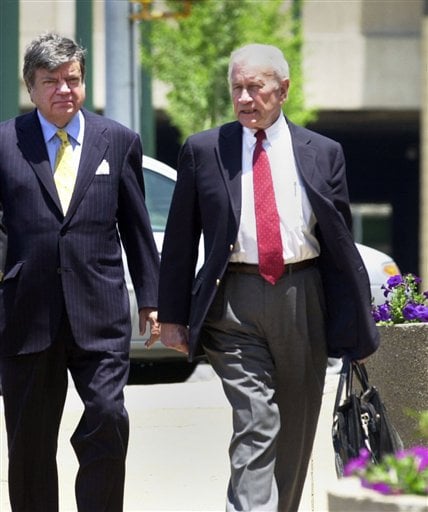 
 FILE - In a June 13, 2005 file photo, attorney James F. Neal, right, talks with his client, businessman Logan Young, center, as they enter into the Clifford Davis Federal building in Memphis, Tenn. Neal, who successfully prosecuted Jimmy Hoffa and Watergate figures and later defended high-profile clients, including Exxon Corp. after the Exxon Valdez oil spill, died Thursday, Oct. 21 in Nashville. He was 81. (AP Photo/Greg Campbell, File)
 