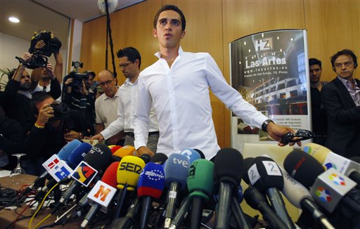 
 Cyclist Alberto Contador of Spain takes his seat to give a press conference in Pinto on the outskirts of Madrid, Thursday Sept. 30, 2010. Three-time Tour de France champion Alberto Contador tested positive for a banned drug while winning this year's race and has been suspended by cycling's governing body. (AP Photo/Andres Kudacki)
 