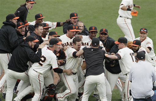 
 The San Francisco Giants celebrate at the end of their baseball game against the San Diego Padres in San Francisco, Sunday, Oct. 3, 2010. San Francisco won the game 3-0 to win the National League West Division title. (AP Photo/Eric Risberg)
 