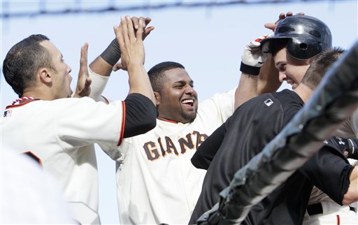 
 San Francisco Giants' Buster Posey, top right, is congratulated by Andres Torres, left, Pablo Sandoval, center, and Freddy Sanchez after hitting a solo home run off of San Diego Padres' Luke Gregerson in the eighth inning of a baseball game in San Francisco, Sunday, Oct. 3, 2010. (AP Photo/Jeff Chiu)
 