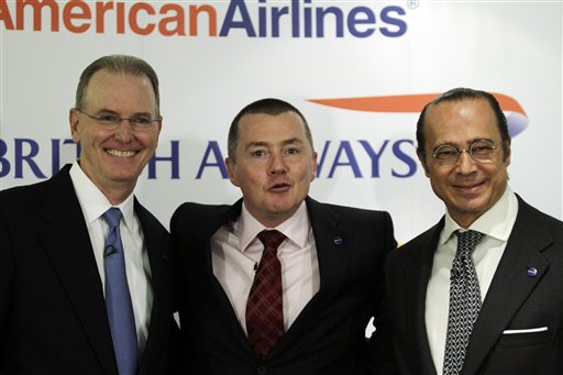 
 Launching a new transatlantic air business, are from left to right, CEOs of American Airlines' Gerard Arpey, British Airways' Willie Walsh and Iberia's Antonio Vazquez, pose for the photographers prior to a news conference to announce the launch of their transatlantic joint business, in central London, Wednesday Oct. 6, 2010. (AP Photo/Lefteris Pitarakis)
 