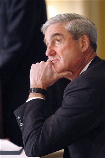 
 FBI Director Robert Mueller listens to his introduction before speaking at a conference on domestic terrorism in Washington, Wednesday, Oct. 6, 2010. (AP Photo/Jacquelyn Martin)
 