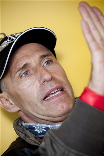 
 Swiss pilot Yves Rossy, the first man in the world to fly under a jet-fitted wing, speaks during a press conference just after he speeded through the air to perform a looping in Bercher, western Switzerland, Friday, Nov. 5, 2010. (AP Photo/Laurent Gillieron, pool)
 