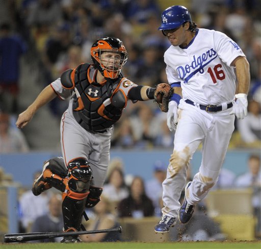 
 FILE-This Sept. 3, 2010 file photo shows San Francisco Giants catcher Buster Posey, left, tagging out Andre Ethier of the Los Angeles Dodgers, after Posey dropped the ball on strike three during the fifth inning of a baseball game in Los Angeles. Posey won the National League Rookie of the Year award in voting announced Monday Nov. 15, 2010 by the Baseball Writers' Association of America. (AP Photo/Chris Carlson,File)
 