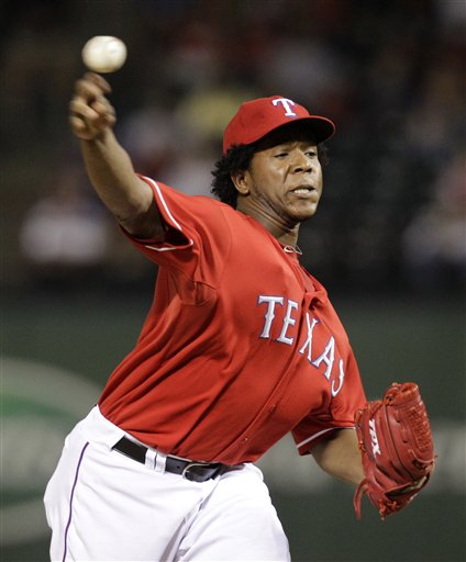 
 FILE-This Oct. 2, 2010 file photo shows Texas Ranger Neftali Feliz delivering to the Los Angeles Angels in the ninth inning of a baseball game in Arlington, Texas. Feliz was named American League Rookie of the Year by the Baseball Writers' Association of America Monday Nov. 15, 2010. (AP Photo/Tony Gutierrez,File)
 