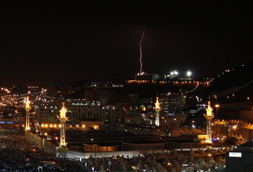 
 Lightening flashes over thousands of tents housing Muslim pilgrims crowded together in Mina , during the annual Hajj in Mecca, Saudi Arabia, Wednesday, Nov. 17, 2010. The annual Islamic pilgrimage draws 2.5 million visitors each year, making it the largest yearly gathering of people in the world. (AP Photo/Hassan Ammar)
 