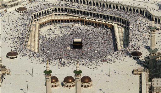 
 This aerial image made from a helicopter shows tens of thousands of Muslim pilgrims moving around the Kaaba, the black cube seen at center, inside the Grand Mosque, during the annual Hajj in Mecca, Saudi Arabia, Wednesday, Nov. 17, 2010. The annual Islamic pilgrimage draws 2.5 million visitors each year, making it the largest yearly gathering of people in the world. (AP Photo/Hassan Ammar)
 