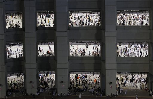 
 Muslim pilgrims are on their way to cast stones at a pillar, symbolizing the stoning of Satan, in a ritual called 'Jamarat,' the last rite of the annual hajj, in Mina near the Saudi holy city of Mecca, , Saudi Arabia, Wednesday, Nov. 17, 2010. The annual Islamic pilgrimage draws 2.5 million visitors each year, making it the largest yearly gathering of people in the world. (AP Photo/Hassan Ammar)
 