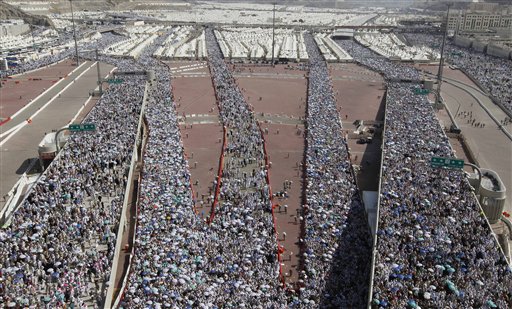 
 Muslim pilgrims on their way to throw cast stones at a pillar, symbolizing the stoning of Satan, in a ritual called 'Jamarat,' the last rite of the annual hajj, in Mina near the Saudi holy city of Mecca, Saudi Arabia in Mecca, Saudi Arabia, Thursday, Nov. 18, 2010. The annual Islamic pilgrimage draws 2.5 million visitors each year, making it the largest yearly gathering of people in the world. (AP Photo/Hassan Ammar)
 