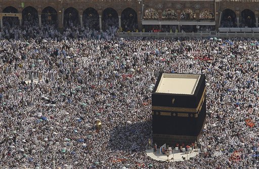 
 This aerial image made from a helicopter shows tens of thousands of Muslim pilgrims moving around the Kaaba, the black cube seen at center, inside the Grand Mosque, during the annual Hajj in Mecca, Saudi Arabia, Wednesday, Nov. 17, 2010. The annual Islamic pilgrimage draws 2.5 million visitors each year, making it the largest yearly gathering of people in the world. (AP Photo/Hassan Ammar)
 