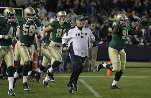 
 Notre Dame coach Brian Kelly runs on the field ahead of his team before the start of an NCAA college football game against Army at Yankee Stadium in New York, Saturday, Nov. 20, 2010. (AP Photo/Kathy Willens)
 