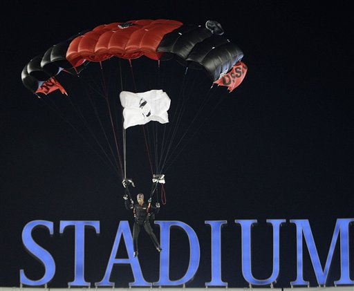 
 A member of the U.S. Army Black Daggers parachute team drops into Yankee Stadium before an NCAA college football game between Army and Notre Dame at Yankee Stadium in New York, Saturday, Nov. 20, 2010. (AP Photo/Kathy Willens)
 