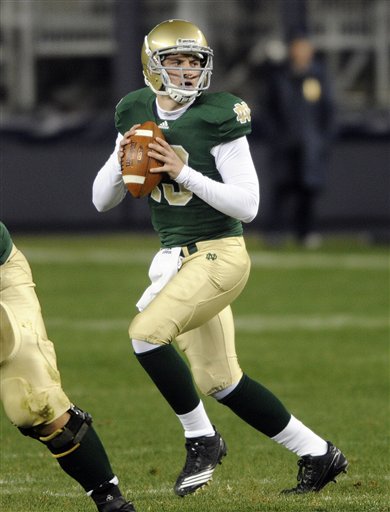 
 Notre Dame quarterback Tommy Rees drops back in the second quarter of an NCAA college football game against Notre Dame at Yankee Stadium in New York, Saturday, Nov. 20, 2010. (AP Photo/Henny Ray Abrams)
 